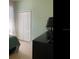 This comfortable bedroom offers ample storage with a spacious closet and dresser, complemented by soft natural light at 2057 Swift Rd, Oviedo, FL 32766