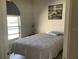 Cozy bedroom features a comfortable bed, natural light from the window, and decorative artwork at 2057 Swift Rd, Oviedo, FL 32766