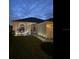 Charming home exterior showcasing manicured lawn, inviting entryway, and well-lit facade at 2057 Swift Rd, Oviedo, FL 32766