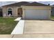 Charming single-Gathering home with a well-maintained lawn and two-car garage at 2057 Swift Rd, Oviedo, FL 32766