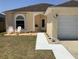 Charming single-story home featuring a landscaped front yard and a covered entryway at 2057 Swift Rd, Oviedo, FL 32766