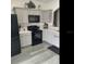 This updated kitchen has modern appliances, granite countertops, and ample cabinet space at 2057 Swift Rd, Oviedo, FL 32766