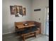 Charming kitchen nook with wooden bench seating, a cozy table, and artwork, perfect for casual dining at 2057 Swift Rd, Oviedo, FL 32766