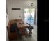 Inviting kitchen nook with built-in bench seating, a dining table, and a view of the outdoor patio at 2057 Swift Rd, Oviedo, FL 32766