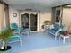 Inviting lanai featuring comfortable blue and white furniture, perfect for relaxation and enjoying the outdoors at 2057 Swift Rd, Oviedo, FL 32766