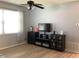Living room featuring ceiling fan and a flat screen TV mounted on top of a black media center at 2057 Swift Rd, Oviedo, FL 32766