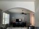 Spacious living area showcasing a cozy sitting area, a large window and a ceiling fan at 2057 Swift Rd, Oviedo, FL 32766
