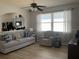 Open-concept living area features hardwood floors and a large window at 2057 Swift Rd, Oviedo, FL 32766