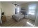 This main bedroom features a dresser, two windows, and a ceiling fan at 2057 Swift Rd, Oviedo, FL 32766