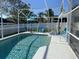 Backyard screened pool area with lounge seating, umbrella, and refreshing clear water at 2057 Swift Rd, Oviedo, FL 32766