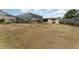 Large backyard with a screened pool enclosure at 220 Escambia Dr, Winter Haven, FL 33884