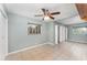 Spacious bedroom featuring tile floors, ceiling fan, and plenty of closet space at 220 Escambia Dr, Winter Haven, FL 33884