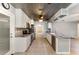 Spacious kitchen featuring stainless steel appliances, and unique tin-look ceiling at 220 Escambia Dr, Winter Haven, FL 33884