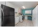 A well-equipped laundry room with appliances and storage cabinets at 220 Escambia Dr, Winter Haven, FL 33884
