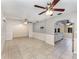 Bright, open living space with tile flooring, light walls, and modern ceiling fans at 220 Escambia Dr, Winter Haven, FL 33884
