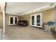 Covered patio featuring neutral paint, a bar, and tile floors at 220 Escambia Dr, Winter Haven, FL 33884