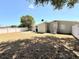 Fenced backyard with lawn, air conditioner, and mature tree offering shade at 2201 Flamingo Ave, Deltona, FL 32738