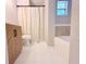 Clean bathroom featuring a modern vanity, toilet, bathtub, and shower with tile surround at 2201 Flamingo Ave, Deltona, FL 32738