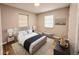 Cozy bedroom featuring a plush bed, serene decor, and ample natural light at 2201 Flamingo Ave, Deltona, FL 32738