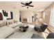 Bright living room with modern furnishings, ceiling fan, neutral colors and wood-look flooring at 2201 Flamingo Ave, Deltona, FL 32738