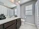 Bathroom with modern sink, shower, and toilet at 9971 Highland Sky Aly, Orlando, FL 32832
