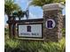 Elegant stone entrance sign for Randal Walk community surrounded by lush landscaping at 9971 Highland Sky Aly, Orlando, FL 32832