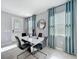 Bright dining area with modern decor, including a sleek table and matching chairs at 9971 Highland Sky Aly, Orlando, FL 32832