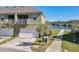 Well-maintained townhome with a two-car garage and serene lake view at 9971 Highland Sky Aly, Orlando, FL 32832