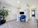 Bright loft with wood flooring, desk, and natural light at 9971 Highland Sky Aly, Orlando, FL 32832