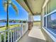 Relaxing porch view overlooking a serene lake, enhanced by a bright blue sky at 9971 Highland Sky Aly, Orlando, FL 32832