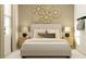 Beautifully decorated bedroom with stylish wall art, soft bedding, and contemporary lamps at 1169 Hour Glass Rd, Lakeland, FL 33801