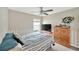 Comfortable bedroom with a ceiling fan, neutral walls, and a cozy atmosphere at 305 St Georges Cir, Eagle Lake, FL 33839