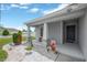 Inviting front porch with decorative accents and a welcoming entrance to the home at 305 St Georges Cir, Eagle Lake, FL 33839