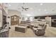 Spacious living room with modern decor, adjacent to the kitchen and dining area, great for entertaining at 305 St Georges Cir, Eagle Lake, FL 33839