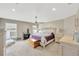 Serene main bedroom with ceiling fan, ample space, and plenty of natural light at 305 St Georges Cir, Eagle Lake, FL 33839