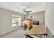 Home office with a large window for natural light, comfortable for remote work at 305 St Georges Cir, Eagle Lake, FL 33839