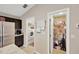Open pantry and laundry room features wire shelving, offering ample storage space at 305 St Georges Cir, Eagle Lake, FL 33839