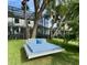Unique backyard featuring a swing bed surrounded by lush greenery and mature trees at 5500 W Lake Butler Rd, Windermere, FL 34786