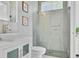 Bright bathroom featuring a glass-walled shower, grey tile and modern vanity at 5500 W Lake Butler Rd, Windermere, FL 34786