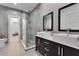 Elegant bathroom with double vanity, glass shower, and neutral tiling at 5500 W Lake Butler Rd, Windermere, FL 34786