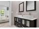 Elegant bathroom with dual sinks, modern fixtures, and sleek cabinetry at 5500 W Lake Butler Rd, Windermere, FL 34786