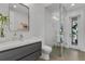 Modern bathroom featuring walk-in shower with glass enclosure, sleek vanity, and stylish fixtures at 5500 W Lake Butler Rd, Windermere, FL 34786