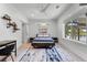 Well-lit bedroom with modern desk, water view, and comfortable bed setting at 5500 W Lake Butler Rd, Windermere, FL 34786