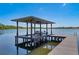 Modern boat lift on the lake with a boat ready to be launched, perfect for water activities at 5500 W Lake Butler Rd, Windermere, FL 34786