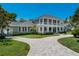 Stately two-story home features a beautiful front yard and a circular driveway at 5500 W Lake Butler Rd, Windermere, FL 34786