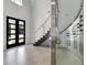 Impressive entryway showcasing a wine cellar, modern staircase, and stylish front door at 5500 W Lake Butler Rd, Windermere, FL 34786