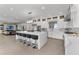 Spacious kitchen featuring stainless appliances, large island with seating, and open concept design at 5500 W Lake Butler Rd, Windermere, FL 34786
