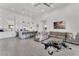 Spacious living area with modern decor, tiled floors, and an open layout perfect for entertaining at 5500 W Lake Butler Rd, Windermere, FL 34786