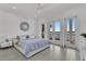 An airy main bedroom features a view of the water and patio access at 5500 W Lake Butler Rd, Windermere, FL 34786