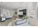 Open-concept bedroom with a seating area, built-in coffee bar, and ensuite bathroom with soaking tub at 5500 W Lake Butler Rd, Windermere, FL 34786